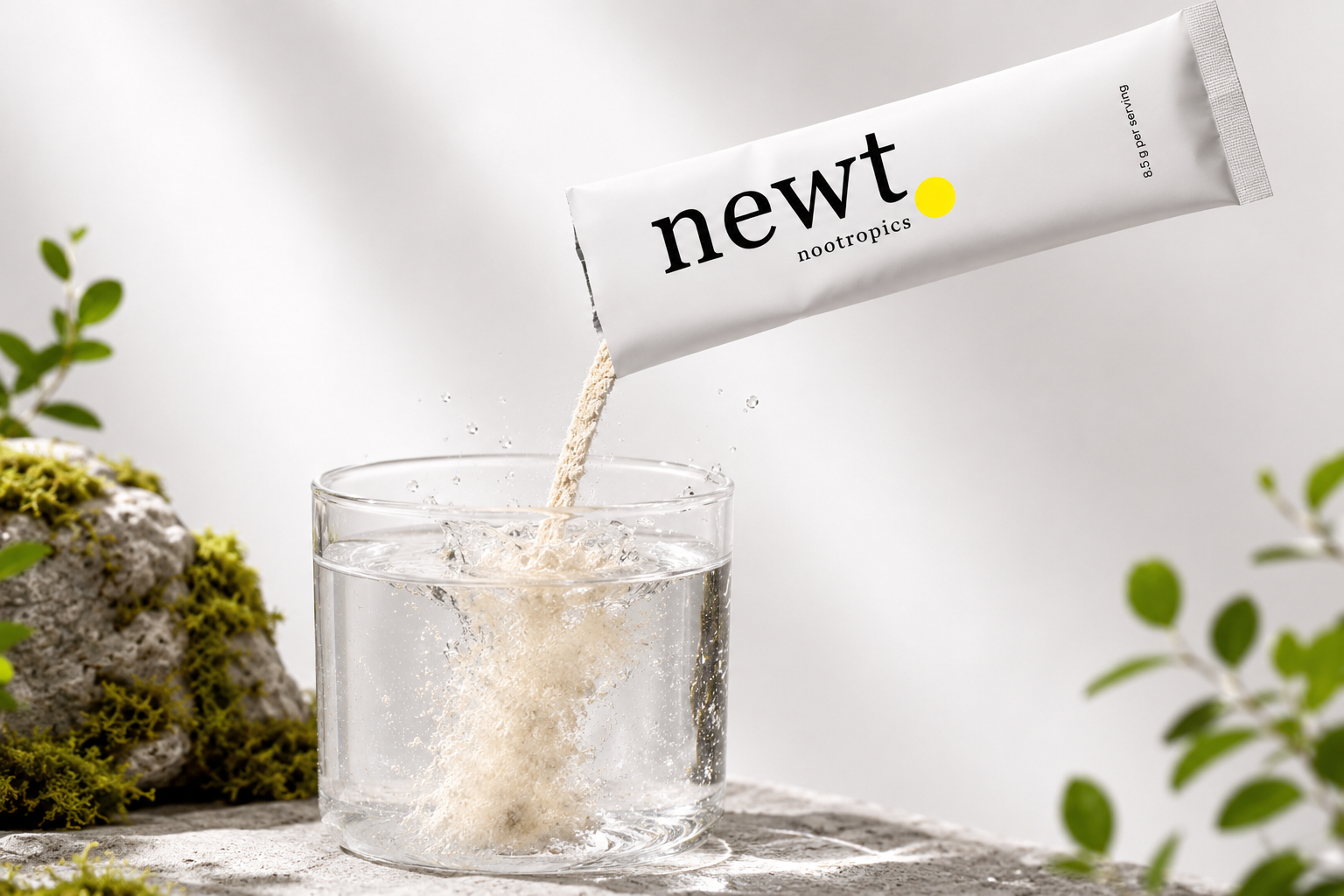 Newt Nootropics powder pouring into a glass of water